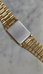 1990 Seiko Quartz Date Adjust Gold Tone Tank Watch