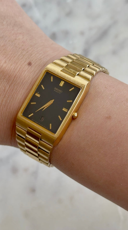 1990 Seiko Quartz Date Adjust Gold Tone Tank Watch