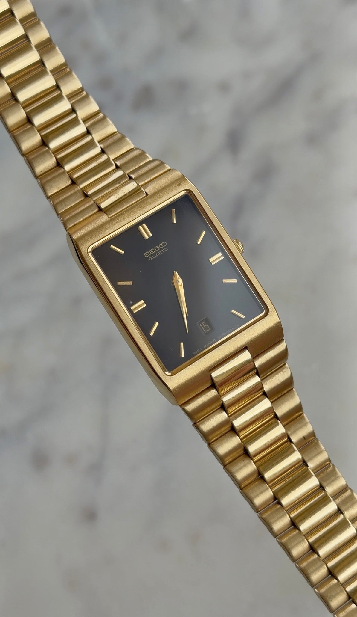 1990 Seiko Quartz Date Adjust Gold Tone Tank Watch