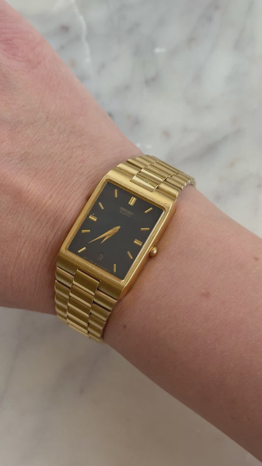 1990 Seiko Quartz Date Adjust Gold Tone Tank Watch