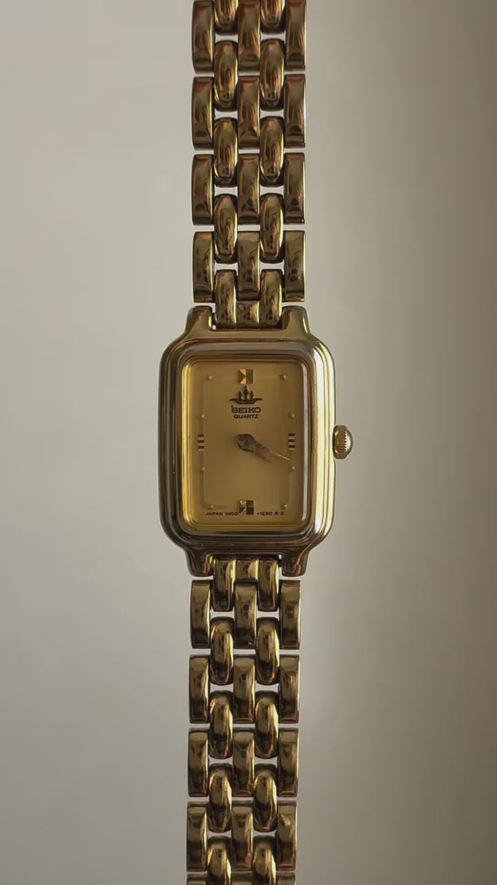 1990 Seiko Galaxy Quartz Gold Tone Gold Dial Tank Watch