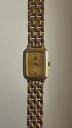 1990 Seiko Galaxy Quartz Gold Tone Gold Dial Tank Watch